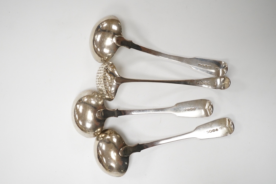A pair of George IV silver fiddle pattern sauce ladles, by Charles Eley, London, 1826, 17cm, together with a George III silver fiddle pattern sauce ladle, London, 1806 and a George III silver Old English pattern sifter l